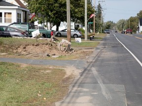 The site where a car crashed into a retaining wall is seen in Blackville, N.B., Sunday, Sept. 13, 2020. Three teenaged boys from central New Brunswick were killed early Sunday when the car they were in slammed into a concrete and stone retaining wall in the rural community.