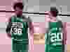 Marcus Smart, left, and Gordon Hayward, right, of the Celtics react during the fourth quarter against the Heat in Game 3 of the Eastern Conference Finals during the 2020 NBA Playoffs at AdventHealth Arena at the ESPN Wide World Of Sports Complex in Lake Buena Vista, Fla., Saturday, Sept. 19, 2020.