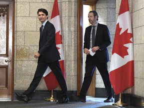 Prime Minister Justin Trudeau leaves his office with his then-principal secretary, Gerald Butts, to attend an emergency cabinet meeting on Parliament Hill in Ottawa on Tuesday, April 10, 2018.