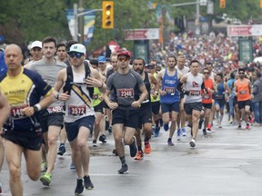 Runners leave the start line of the Scotiabank Ottawa Marathon on May 26, 2019.