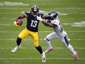James Washington of the Pittsburgh Steelers runs after the catch in the first half against Jalen Mills of the Philadelphia Eagle on October 11, 2020 at Heinz Field in Pittsburgh, Pennsylvania.