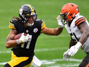 Canadian Chase Claypool of the Pittsburgh Steelers stiff arms Mack Wilson of the Cleveland Browns during their NFL game at Heinz Field on Sunday.