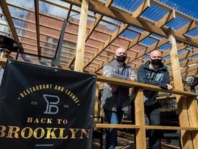 Back to Brooklyn co-owners William Lesniowski (L) and Jamie Love on the large front patio of their ByWard Market restaurant.