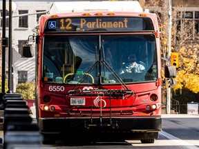 An OC Transpo bus operator drives on the Mackenzie King Bridge on Tuesday.