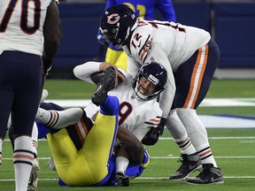 Bears quarterback Nick Foles is sacked by linebacker Terrell Lewis of the Los Angeles Rams on Monday.