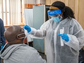 Michael Stanley, an employee for the MTA, is administered a COVID-19 test on October 30, 2020 in New York.