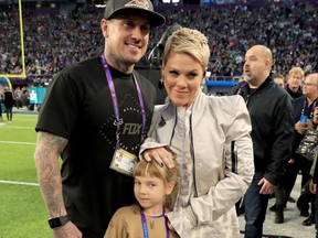 Pink, right, poses with Carey Hart, left, and daughter Willow Sage Hart before the national anthem during the Super Bowl LII pre-game show at U.S. Bank Stadium on Feb. 4, 2018 in Minneapolis, Minnesota.