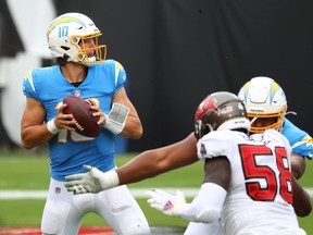 Los Angeles Chargers quarterback Justin Herbert throws a pass against the Tampa Bay Buccaneers in the second quarter at Raymond James Stadium. Herbert has officially been named the team's No. 1 quarterback.