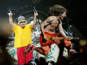 Sam Hagar, left, one of Van Halen's many lead singers in the band's long history, stands next to Eddie Van Halen at the Air Canada Centre in this 2004 file photo.