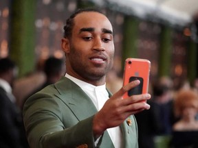 New England Patriots Stephon Gilmore takes a selfie on the red carpet prior to the NFL Honors awards presentation at Adrienne Arsht Center in Miami, Fla., Feb 1, 2020.