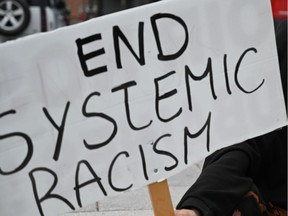An End Systemic Racism sign