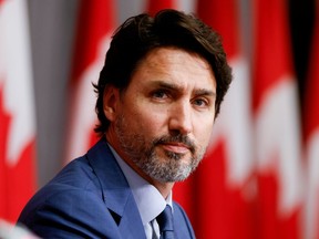 FILE PHOTO: Canada's Prime Minister Justin Trudeau takes part in a news conference on Parliament Hill in Ottawa, Ontario, Canada September 25, 2020.