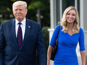 In this file photo taken on Sept. 15, 2020, U.S. President Donald Trump walks alongside White House Press Secretary Kayleigh McEnany prior to departing on Marine One from the South Lawn of the White House in Washington, D.C., as he travels to Philadelphia, Pa., for a town hall.