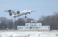 A Porter Airlines plane takes off from Billy Bishop island airport.