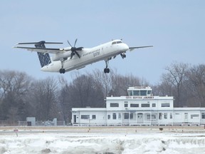 A Porter Airlines plane takes off from Billy Bishop island airport.