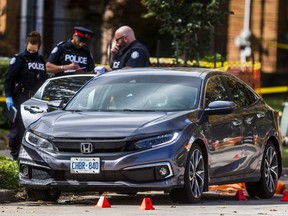 Toronto Police attend the scene of a deadly drive-by shooting on Patika Ave., west of Merrill Ave., in the Lawrence and Jane area on Thursday, Oct. 1, 2020.
