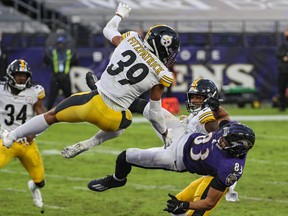 Steelers' safety Minkah Fitzpatrick #39 and cornerback Justin Layne #31 break up a pass intended for Ravens  wide receiver Willie Snead on the last play of the game during Pittsburgh's 28-24, win at Baltimore on Sunday.