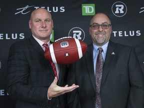 GM Marcel Desjardins (right) makes the official introduction of Paul LaPolice as the new head coach of the Ottawa Redblacks.