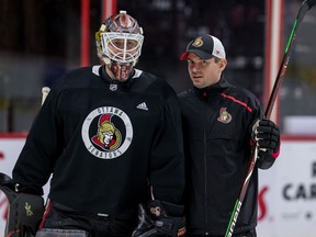 Ottawa Senator goaltender Marcus Hogberg with goaltending coach Pierre Groulx during team practice at the Canadian Tire Centre. December 13, 2019.