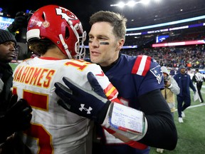 Kansas City Chiefs quarterback Patrick Mahomes (left) and New England Patriots quarterback Tom Brady chat after a game last season. Brady, who has since joined the Tampa Bay Buccaneers, will be looking to right the ship against Mahomes’ 9-1 Chiefs this weekend.