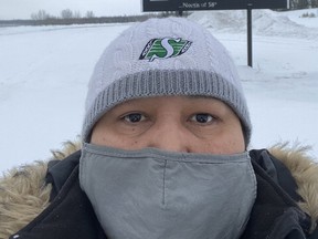 Diane McDonald poses for a selfie wearing a mask in Fond du Lac Denesuline Nation in northern Saskatchewan in this recent handout photo.