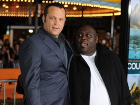Actor Vince Vaughn, left, and Faizon Love pose for photographers as they arrives on the red carpet for the premiere of the new Universal Pictures movie "Couples Retreat" at Mann's Village Theater in Los Angeles, on Oct. 5, 2009.