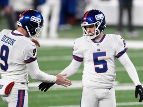 Giants kicker Graham Gano, right, reacts with Riley Dixon at after converting a field goal in the second half against the Buccaneers at MetLife Stadium in East Rutherford, N.J., Nov. 2, 2020.
