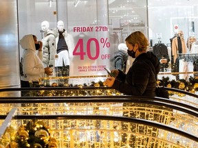 People visit at the Shops at Hudson Yards during early opening for the Black Friday sales in Manhattan, New York, U.S., November 27, 2020.