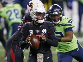 Arizona Cardinals quarterback Kyler Murray (1) drops back to pass against the Seattle Seahawks at Lumen Field.