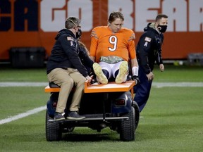 Bears QB Nick Foles is carted off of the field after being hit by Ifeadi Odenigbo of the Vikings during the fourth quarter of the game at Soldier Field in Chicago, Monday, Nov. 16, 2020.