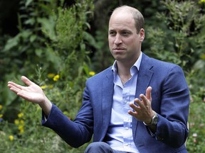 Prince William, Duke of Cambridge, speaks with service users during a visit to the Garden House part of the Light Project on July 16, 2020 in Peterborough, England.