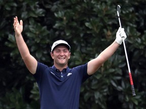 Jon Rahm of Spain celebrates skipping in for a hole in one on the 16th hole during a practice round prior to the Masters at Augusta National Golf Club on Nov. 10, 2020 in Augusta, Ga.