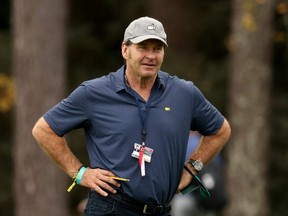 Sir Nick Faldo looks on during a practice round prior to the Masters at Augusta National Golf Club.