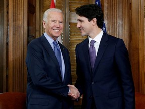 Prime Minister Justin Trudeau (right) shakes hands with U.S. Vice President Joe Biden during a meeting in Trudeau's office on Parliament Hill in Ottawa, Dec. 9, 2016.