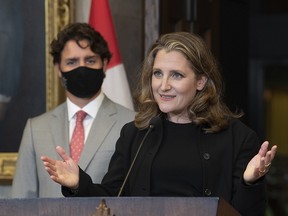 Prime Minister Justin Trudeau looks on as Deputy Prime Minister and Finance Minister Chrystia Freeland responds to a question during a news conference on Parliament Hill in Ottawa, Tuesday, Aug. 18, 2020.