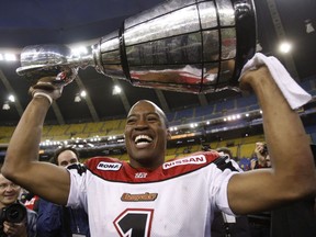 Calgary Stampeders quarterback and game MVP Henry Burris holds the Grey Cup after defeating the Montreal Alouettes on Nov. 23, 2008, in Montreal.