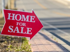 A real estate home for sale sign.