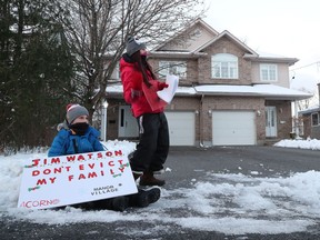 Activists protest near Mayor Jim Watson's driveway on Nov. 24.