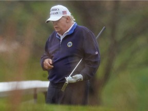 U.S. President Donald Trump plays golf at the Trump National Golf Club in Sterling, Virginia, U.S., Nov. 15, 2020.