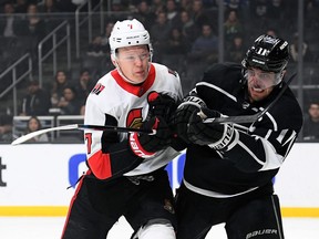 Brady Tkachuk of the Senators, left, battles for position with Anze Kopitar of the Kings during a game on March 11, the last contest the Senators played before the NHL halted play because of COVID-19.
