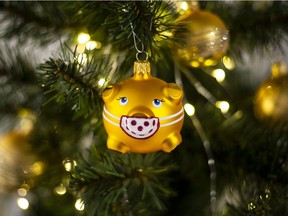 A Christmas decoration decorated with face mask.