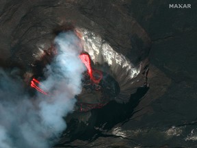 A Maxar's WorldView-2 satellite colour infrared image shows a closeup view of the Kilauea volcano crater and lava erupting of the Kilauea volcano in Hawaii, Dec. 21, 2020.