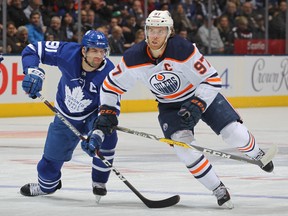 Oilers' Connor McDavid skates against Leafs' John Tavares during a game last season.