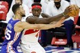 Raptors' Pascal Siakam is guarded 76ers' Ben Simmons on Tuesday night.