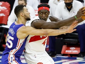 Raptors' Pascal Siakam is guarded 76ers' Ben Simmons on Tuesday night.