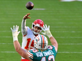 Kansas City Chiefs quarterback Patrick Mahomes (15) attempts a pass over Miami Dolphins outside linebacker Andrew Van Ginkel (43) during the first half at Hard Rock Stadium.