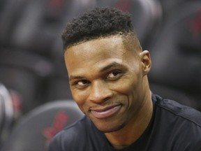 Houston Rockets guard Russell Westbrook smiles during warmups before playing against the Phoenix Suns at Toyota Center.
