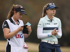 Canadian Brooke Henderson (right) talks with her caddie and sister, Brittany, during the second round of the 75th U.S. Women's Open Championship at Champions Golf Club Cypress Creek Course on Friday in Houston, Texas.