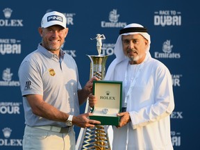 Lee Westwood of England celebrates after winning the Race to Dubai following Day 4 of the DP World Tour Championship at Jumeirah Golf Estates on Dec. 13, 2020 in Dubai, United Arab Emirates.