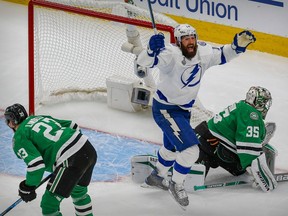 Tampa Bay Lightning left wing Patrick Maroon (14) celebrates a goal by center Blake Coleman (not pictured) against Dallas Stars goaltender Anton Khudobin (35) during the second period in game six of the 2020 Stanley Cup Final at Rogers Place.